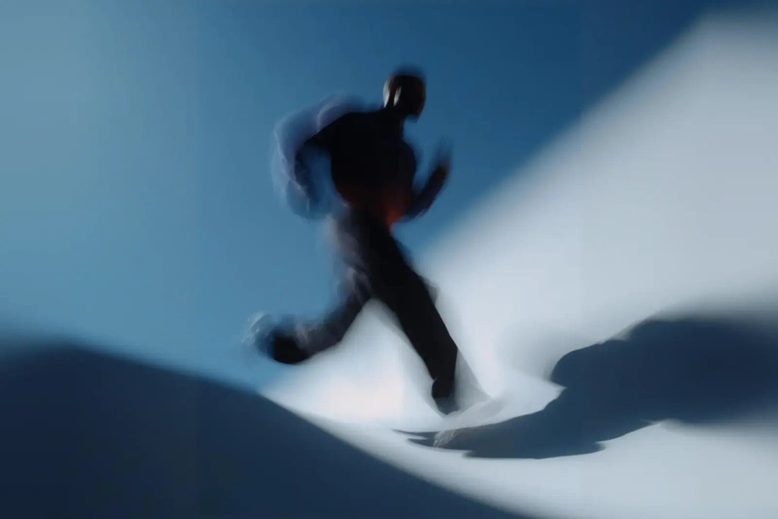 Figure in motion under blue light
