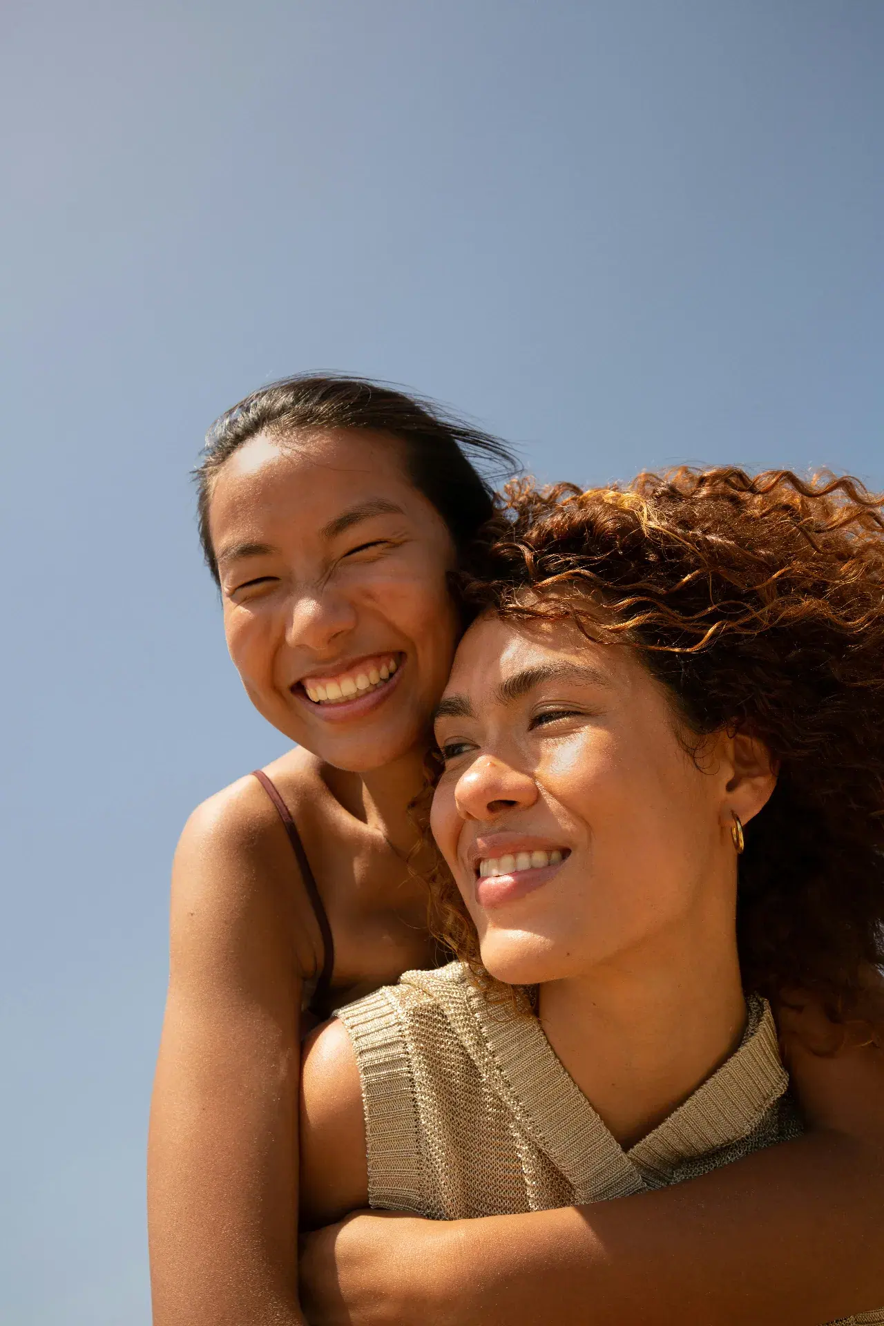 Two patients smiling in the sun